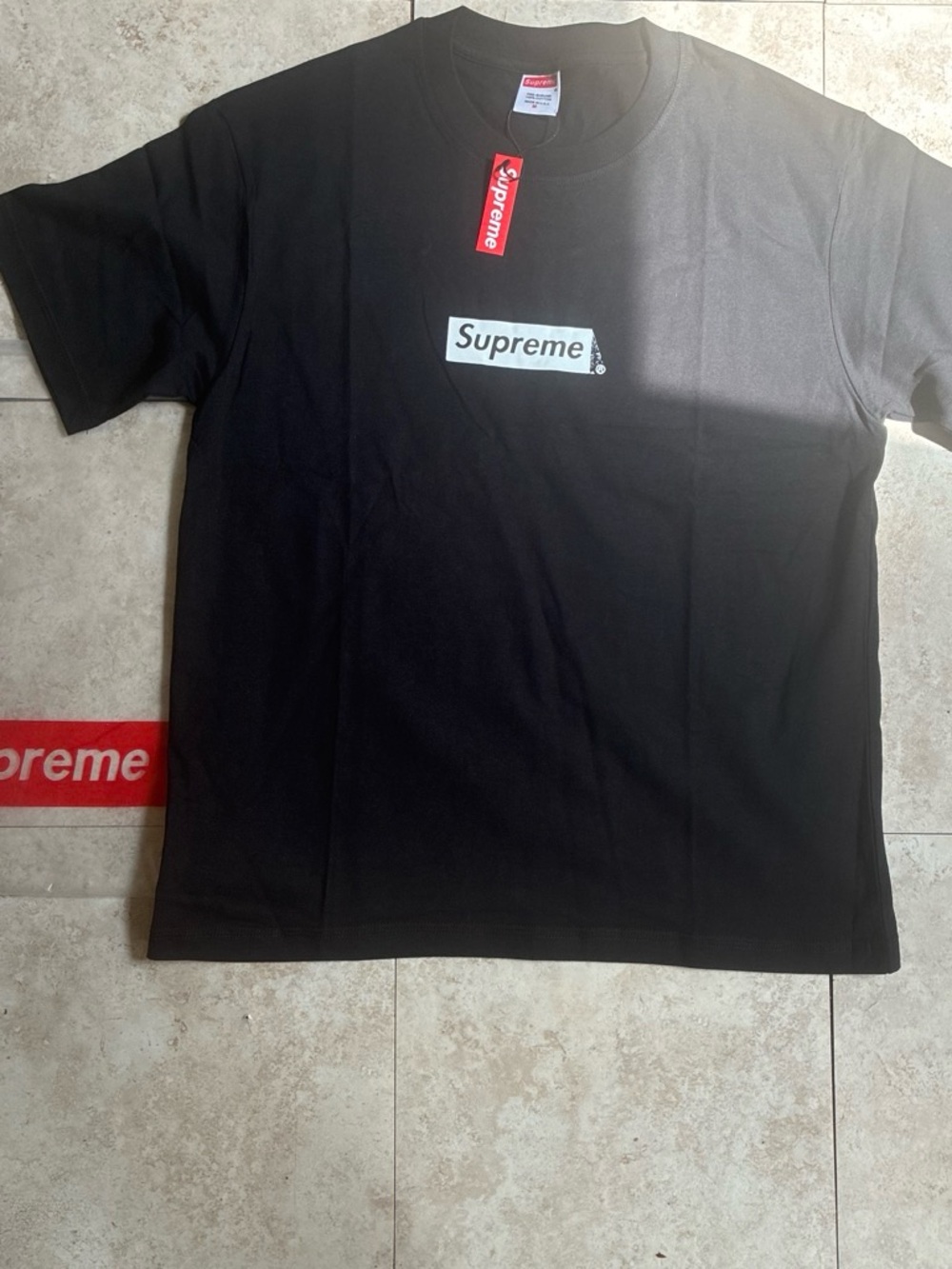 Supreme Black T-Shirt with White Box Logo and Red Tag
